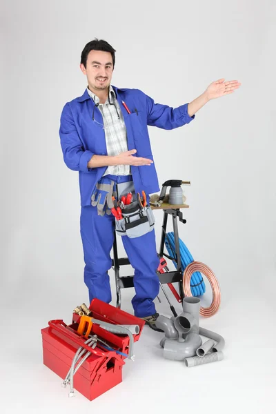 Plumber showing with his hands — Stock Photo, Image