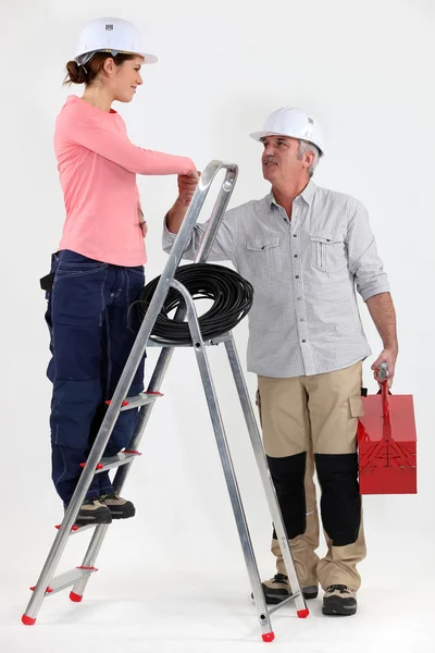 Electrician welcoming helper — Stock Photo, Image