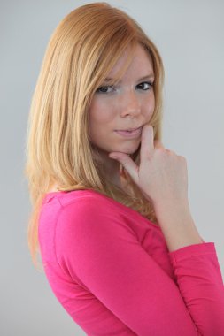 Portrait of young blonde looking puzzled clipart