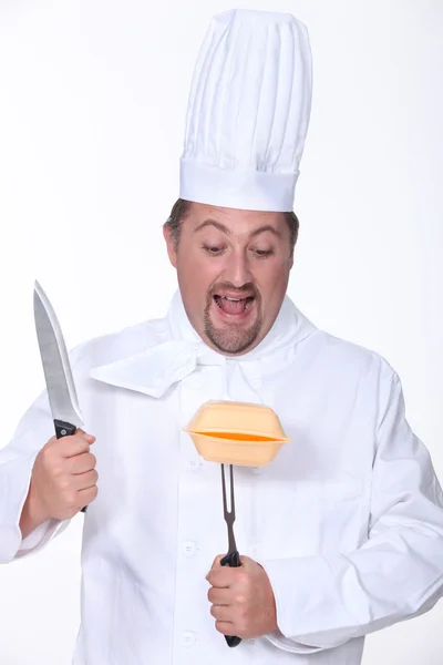 Chef about to carve a polystyrene box — Stock Photo, Image