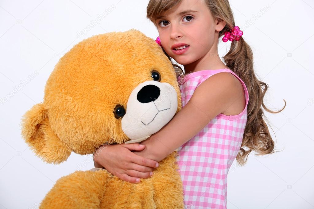 girl in giant teddy bear