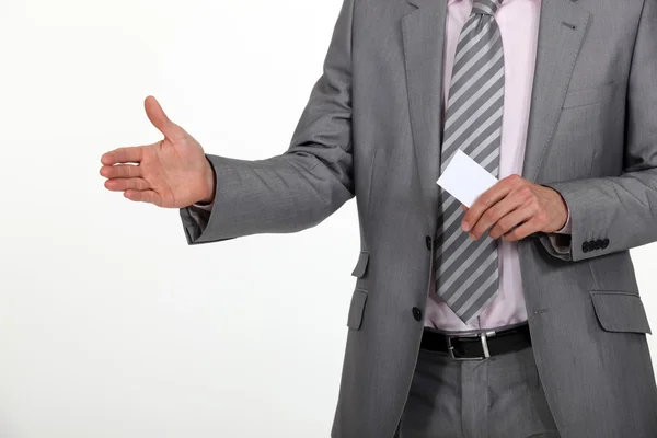 Man holding hand out and carrying business card — Stock Photo, Image