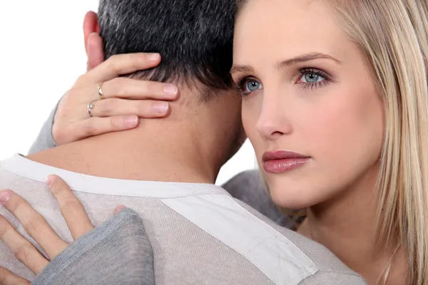 Woman comforting her husband. Stock Picture