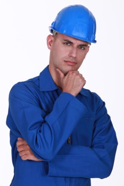 Portrait of a pensive tradesman clipart