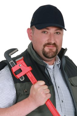 Portrait of a confident plumber clipart