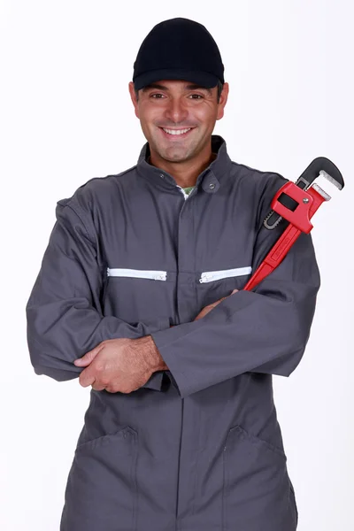 Mechanic holding a spanner — Stock Photo, Image