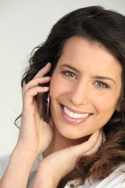 Brunette woman on the phone — Stock Photo, Image