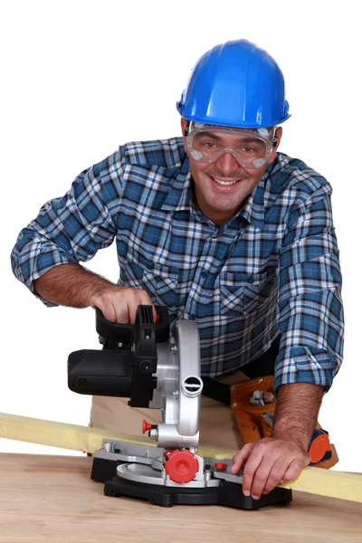 Craftsman working with an electric saw — Stock Photo, Image