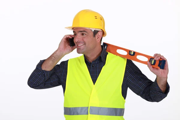 Tradesman talking on the phone — Stock Photo, Image