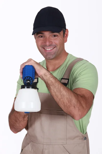 Man with spray gun — Stock Photo, Image