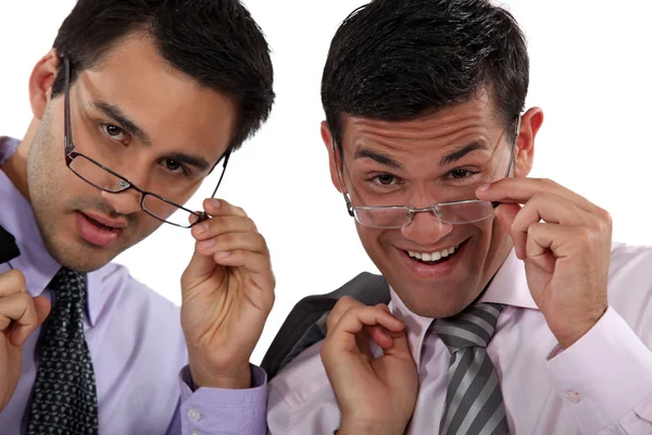 Duo of executives with glasses lowered — Stock Photo, Image