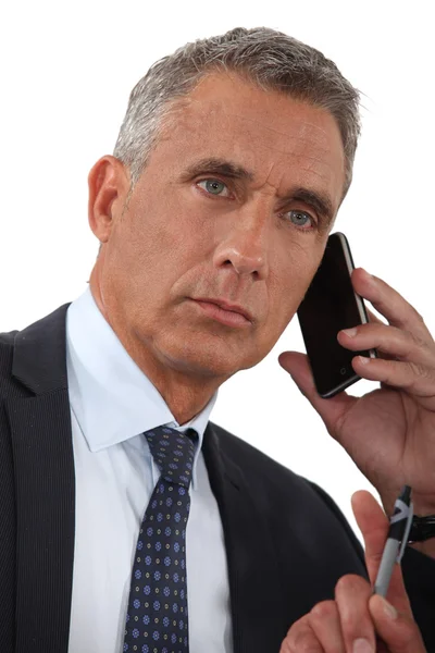 Close-up of businessman talking on his cell — Stock Photo, Image