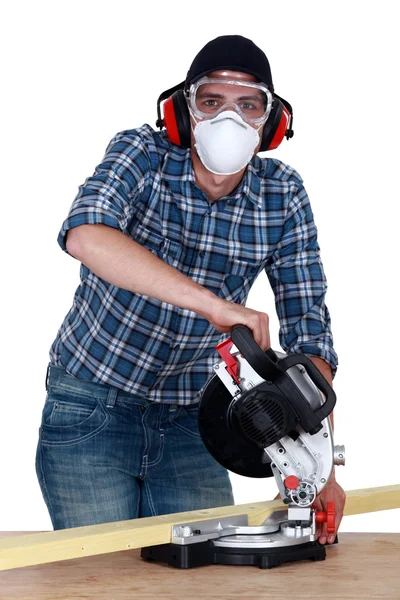 A carpenter with a circular saw. — Stock Photo, Image