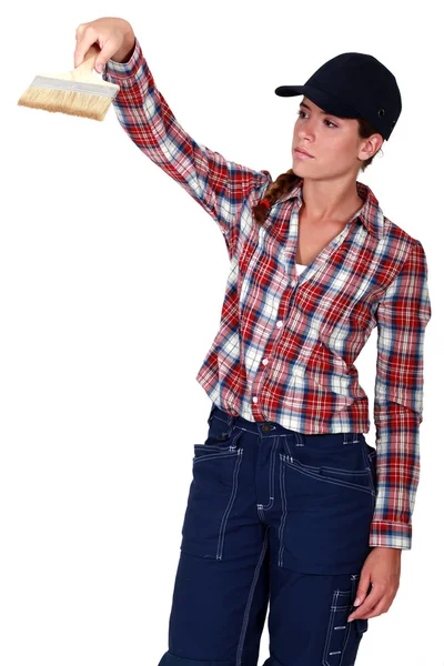 Woman using a paintbrush — Stock Photo, Image