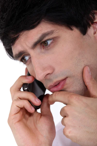 Closeup of young man talking on the phone — Stock Photo, Image