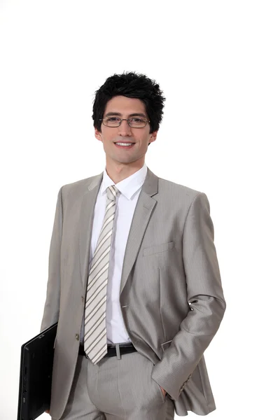 Jonge zakenman met een laptop — Stockfoto
