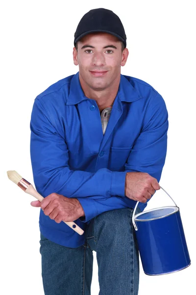 Painter decorator holding brush and can — Stock Photo, Image