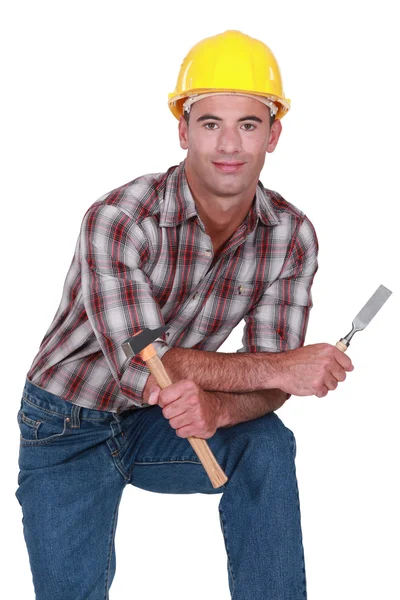 Carpenter with a hammer and chisel — Stock Photo, Image