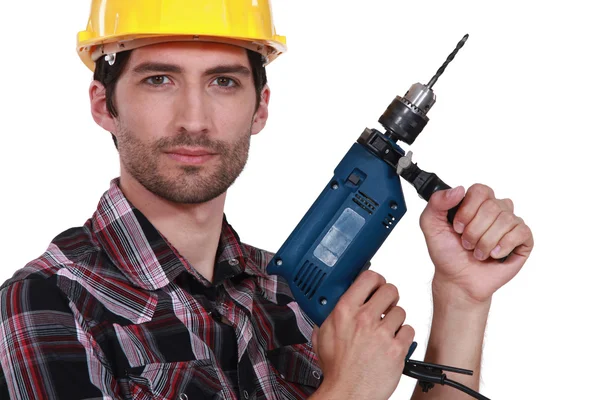 Tradesman segurando uma chave de fenda elétrica — Fotografia de Stock