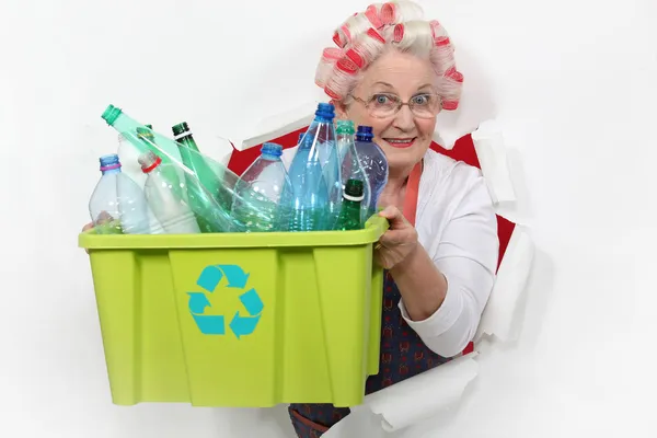 Old lady recycling plastic bottles — Stock Photo, Image