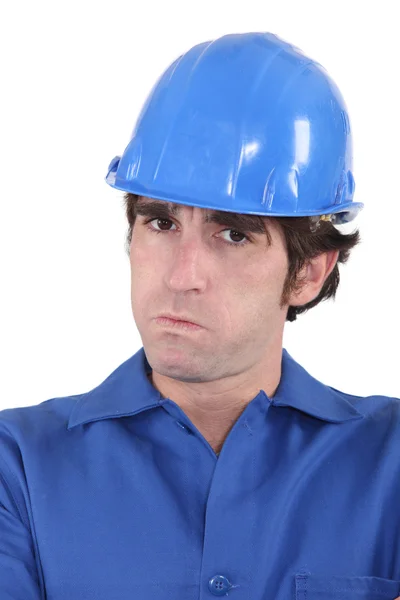 Head-and-shoulders portrait of craftsman looking exasperated — Stock Photo, Image