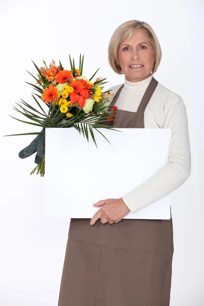 Florist med en styrelse tomt för ditt meddelande — Stockfoto