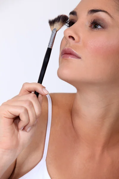 Woman with make-up brush — Stock Photo, Image