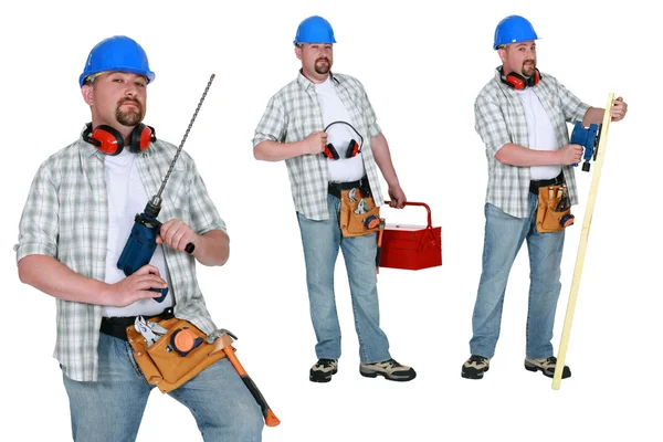 Carpenter standing with various tools Stock Photo