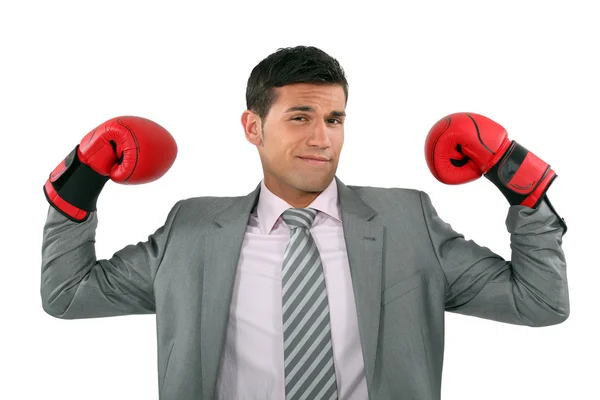 Businessman wearing boxing gloves — Stock Photo, Image