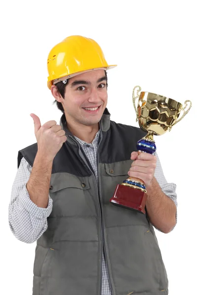 Construction worker with trophy — Stock Photo, Image