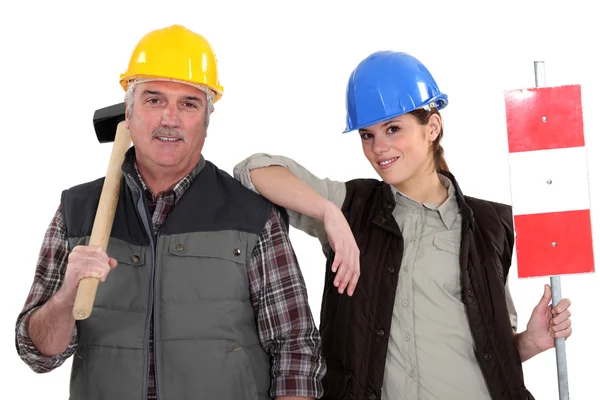 A manual worker and his trainee. — Stock Photo, Image