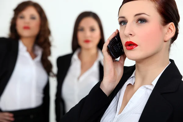 Sexy businesswomen with a cellphone — Stock Photo, Image