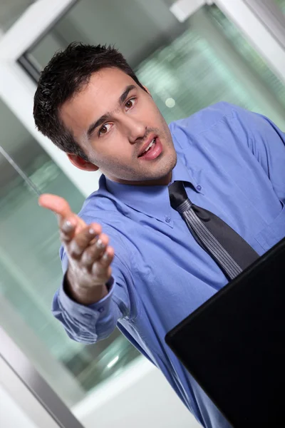 Businessman holding his hand out for a handshake — Stock Photo, Image