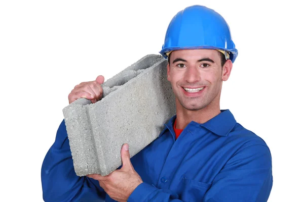 Artisan with concrete block on shoulder — Stock Photo, Image