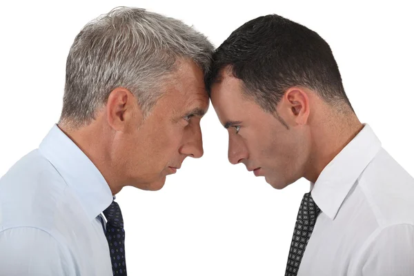 Businessmen stood head-to-head Stock Picture