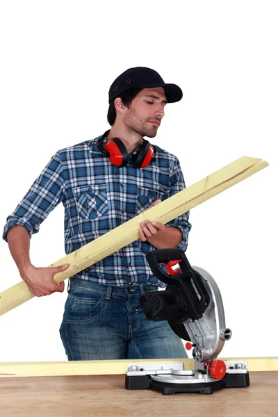 Carpenter cutting wooden slats — Stock Photo, Image