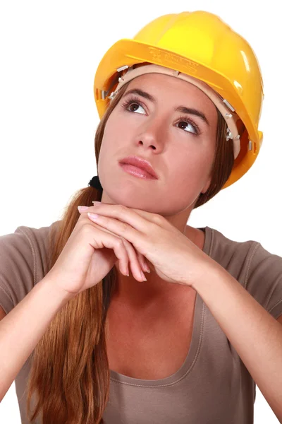 A pensive female construction worker. Stock Photo