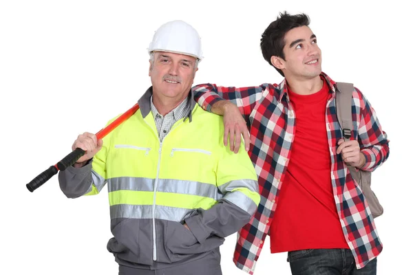 Builder stood with new employee — Stock Photo, Image