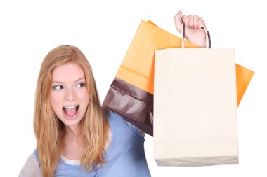 Woman with her shopping bags clipart