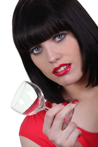 Brunette woman with glass in hand — Stock Photo, Image