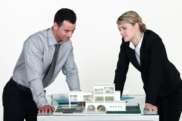 Architects looking at a 3D model — Stock Photo, Image