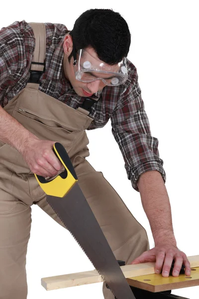 A carpenter sawing. — Stock Photo, Image