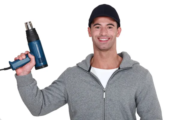 Homem com uma arma de calor — Fotografia de Stock