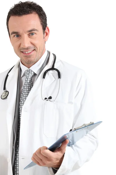 Doctor with clipboard smiling — Stock Photo, Image