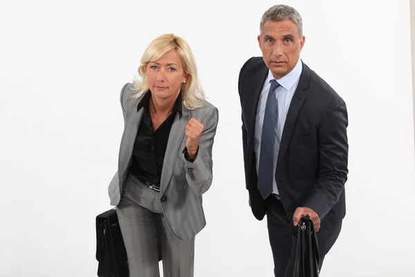 Two businesspeople about to race — Stock Photo, Image