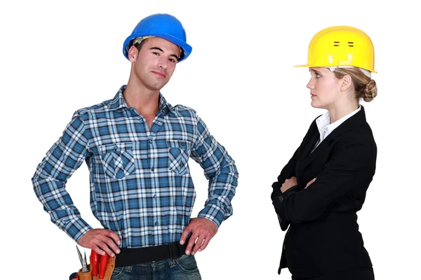 Businesswoman and craftsman posing together — Stock Photo, Image