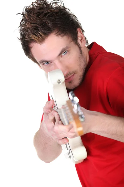 Man pretending electric guitar is a gun — Stock Photo, Image