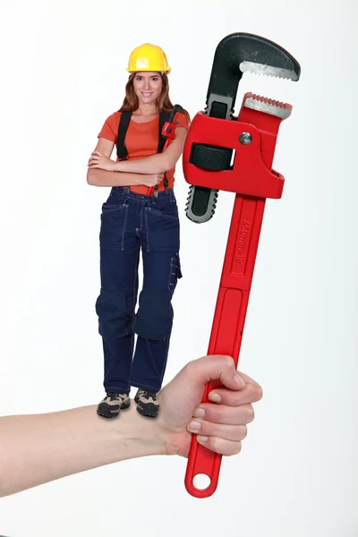 Woman holding wrench — Stock Photo, Image