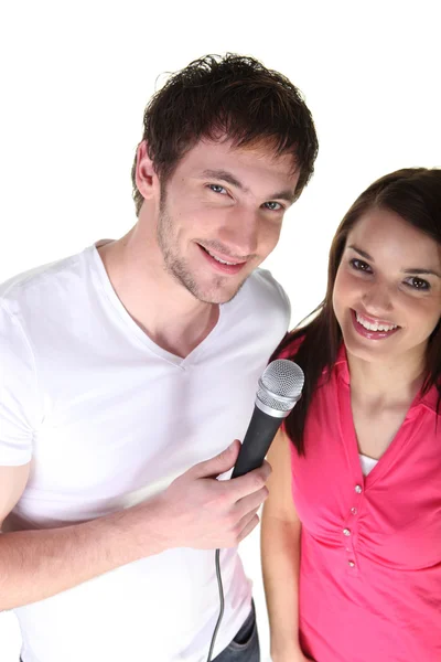 Couple sharing a microphone Stock Picture