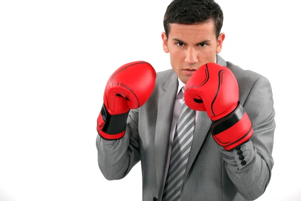 A businessman wearing boxing gloves — Stock Photo, Image